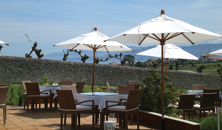 Palacio de Luces Green Spain terrace outdoor seating area umbrellas lawn shrubbery