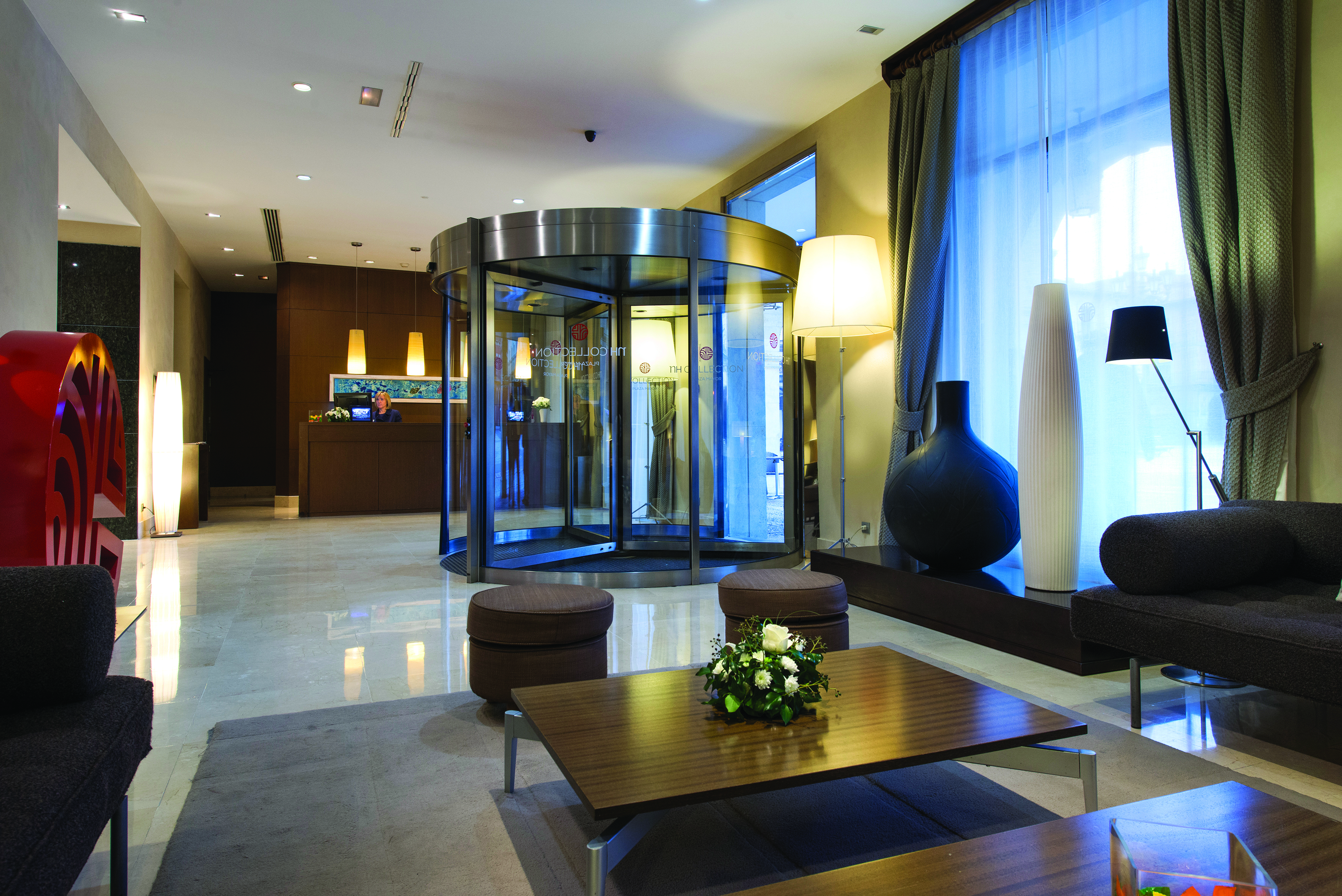 NH Collection Leon Plaza Mayor Green Spain lobby reception desk seating area revolving doors