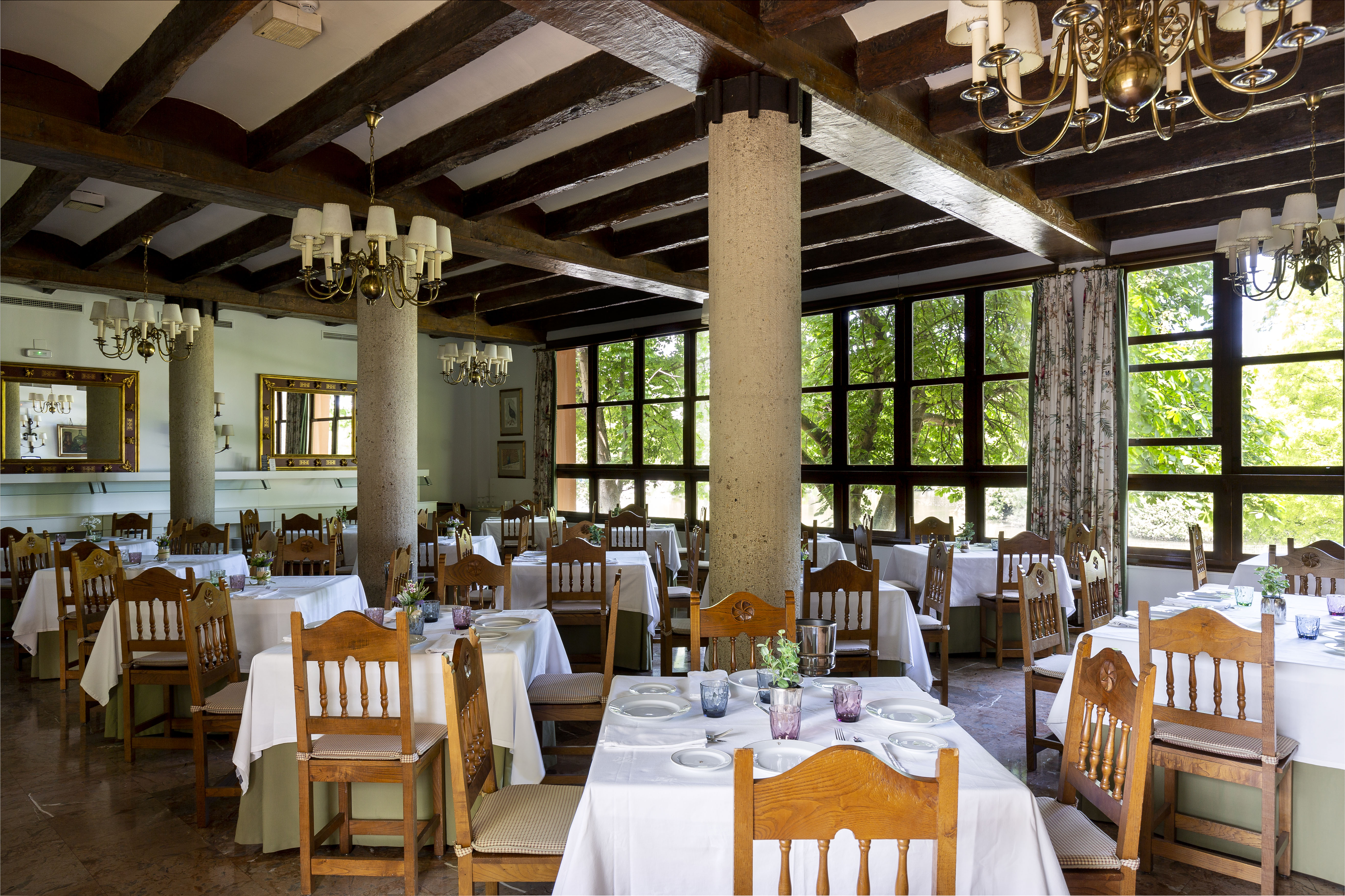 Parador de Gijon restaurant, dining tables, chairs, traditional decor