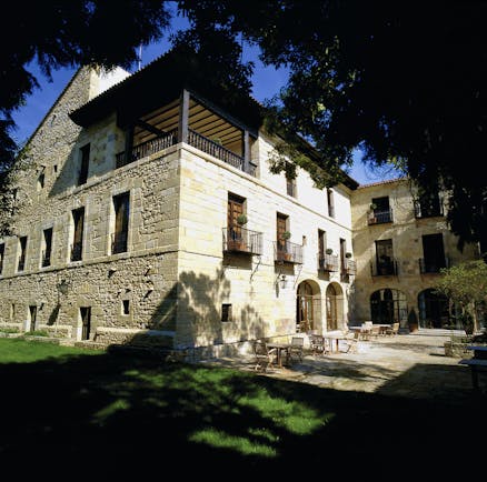 Parador de Santillana Gil Blas Green Spain patio outdoor seating area