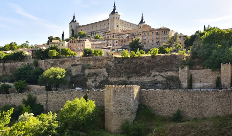 The square shaped Alcazar of Toledo on hill top above city fortifications