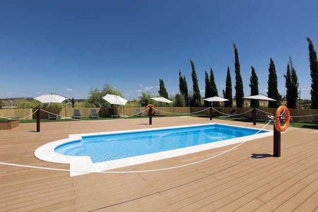 Hospes Palacio de Arenales Heart of Spain pool terrace lawns sun loungers umbrellas