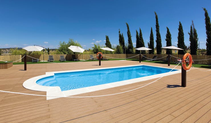 Hospes Palacio de Arenales Heart of Spain pool terrace lawns sun loungers umbrellas