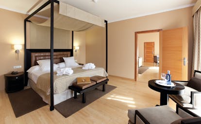 Hospes Palacio de Arenales Heart of Spain suite bedroom four poster bed modern décor