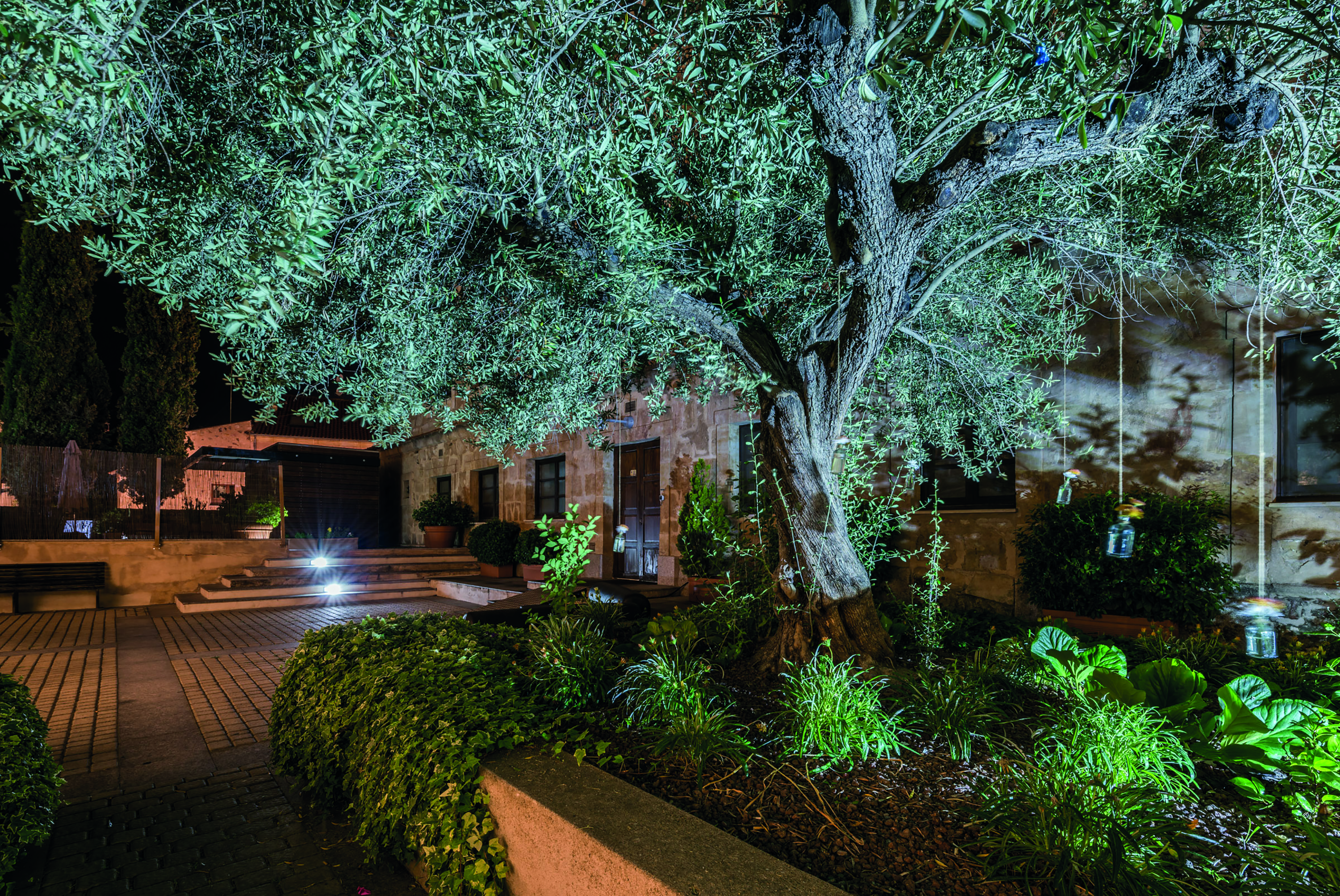 Hospes Palacio de San Esteban Heart of Spain gardens and patio at night trees