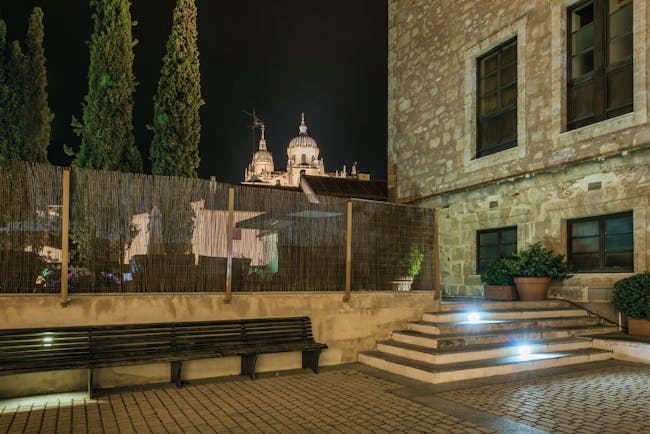 Hospes Palacio de San Esteban Heart of Spain patio at night cathedral in background