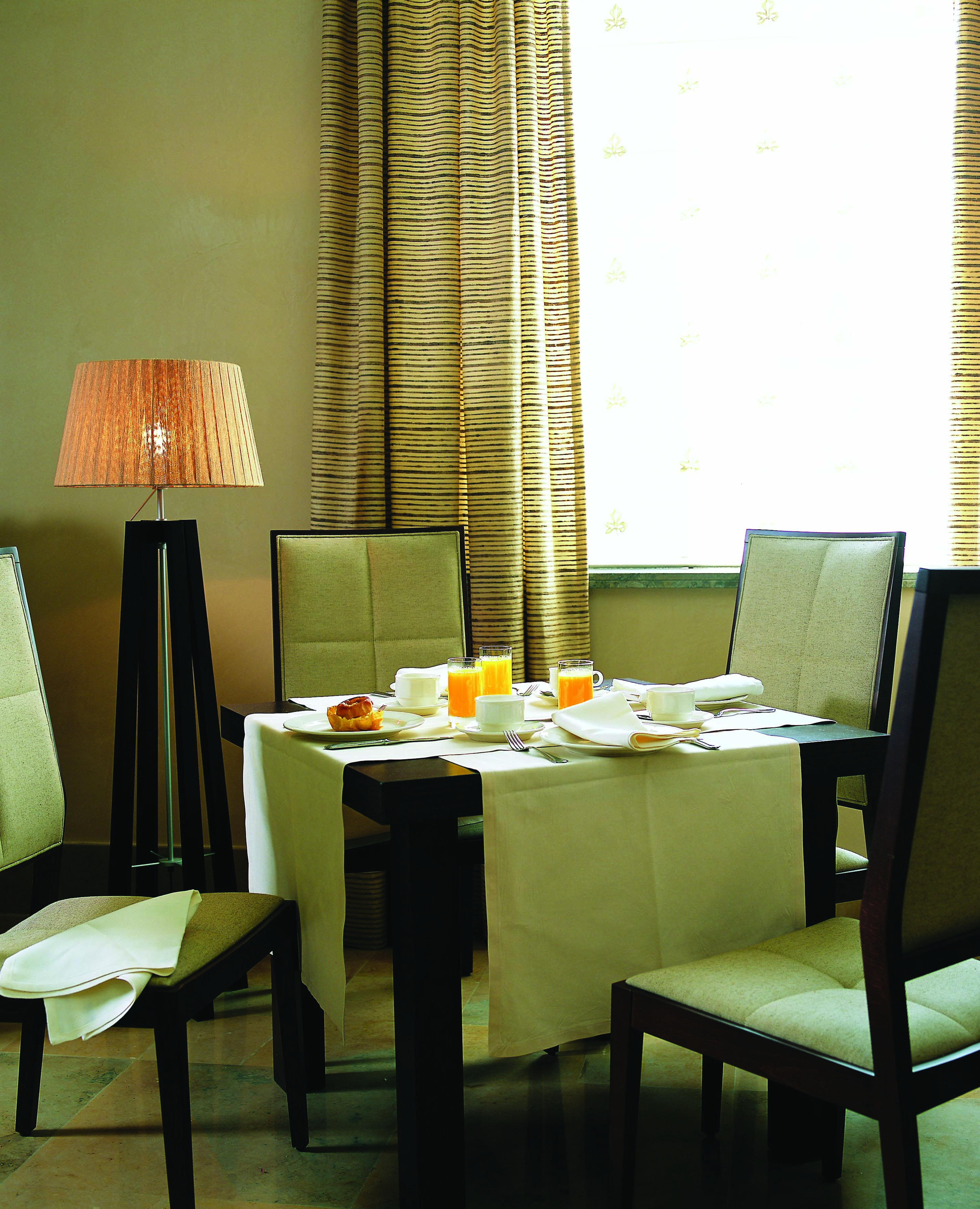 Palacio de la Merced Heart of Spain breakfast table orange juice modern décor