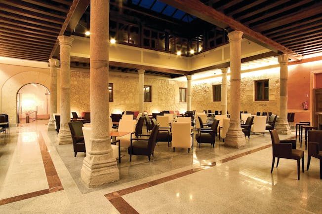 Palacio San Facundo Heart of Spain atrium indoor seating area marble floors columns modern décor