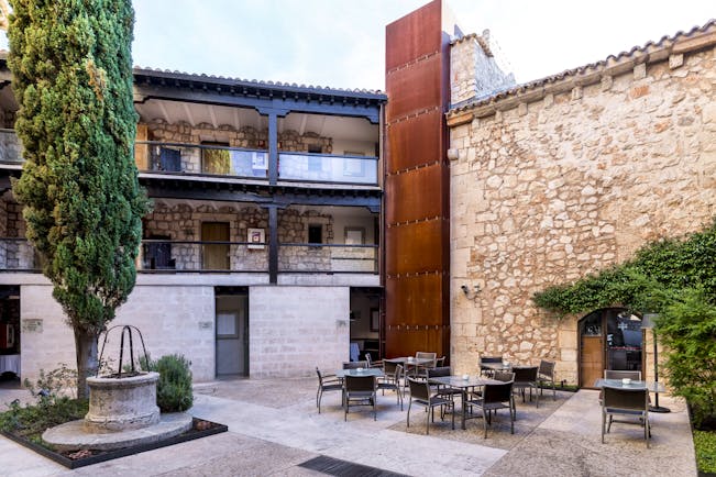 Parador de Alarcon courtyard with trees and chairs