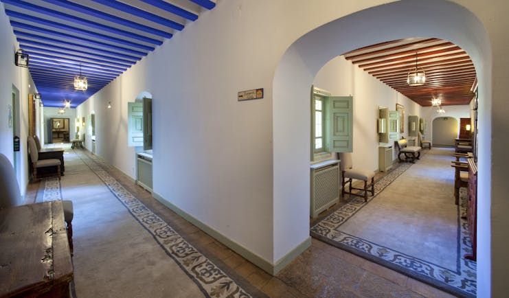 Parador de Almagro interior, hallway, traditional architecture in bright colours, marble floors