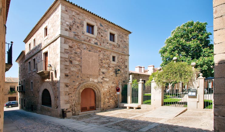 Exterior of hotel a stone building with small windows