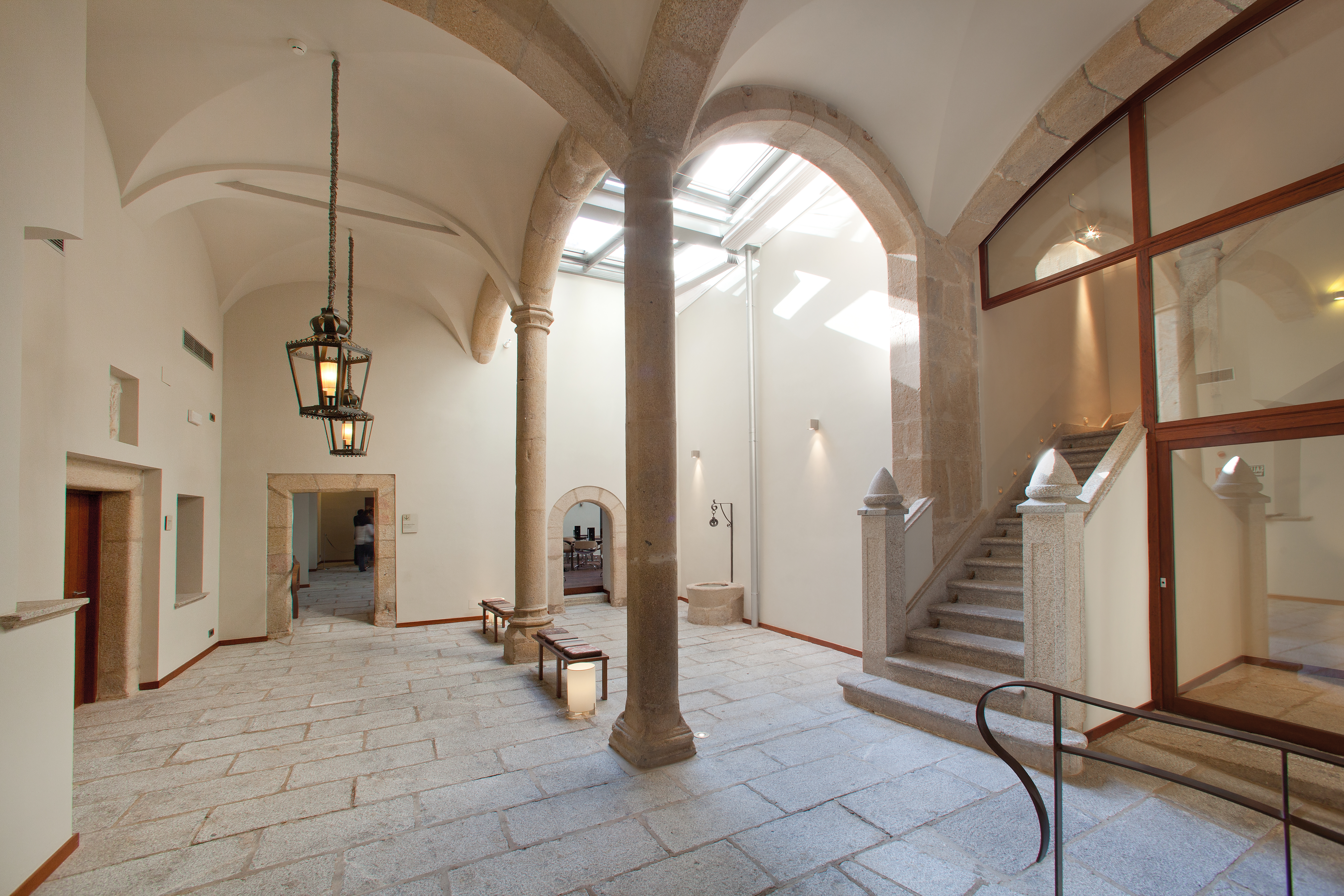 Interior of hotel with stone columns and archways 