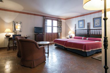 Parador de Merida Heart of Spain standard double bed room bed seating area traditional décor