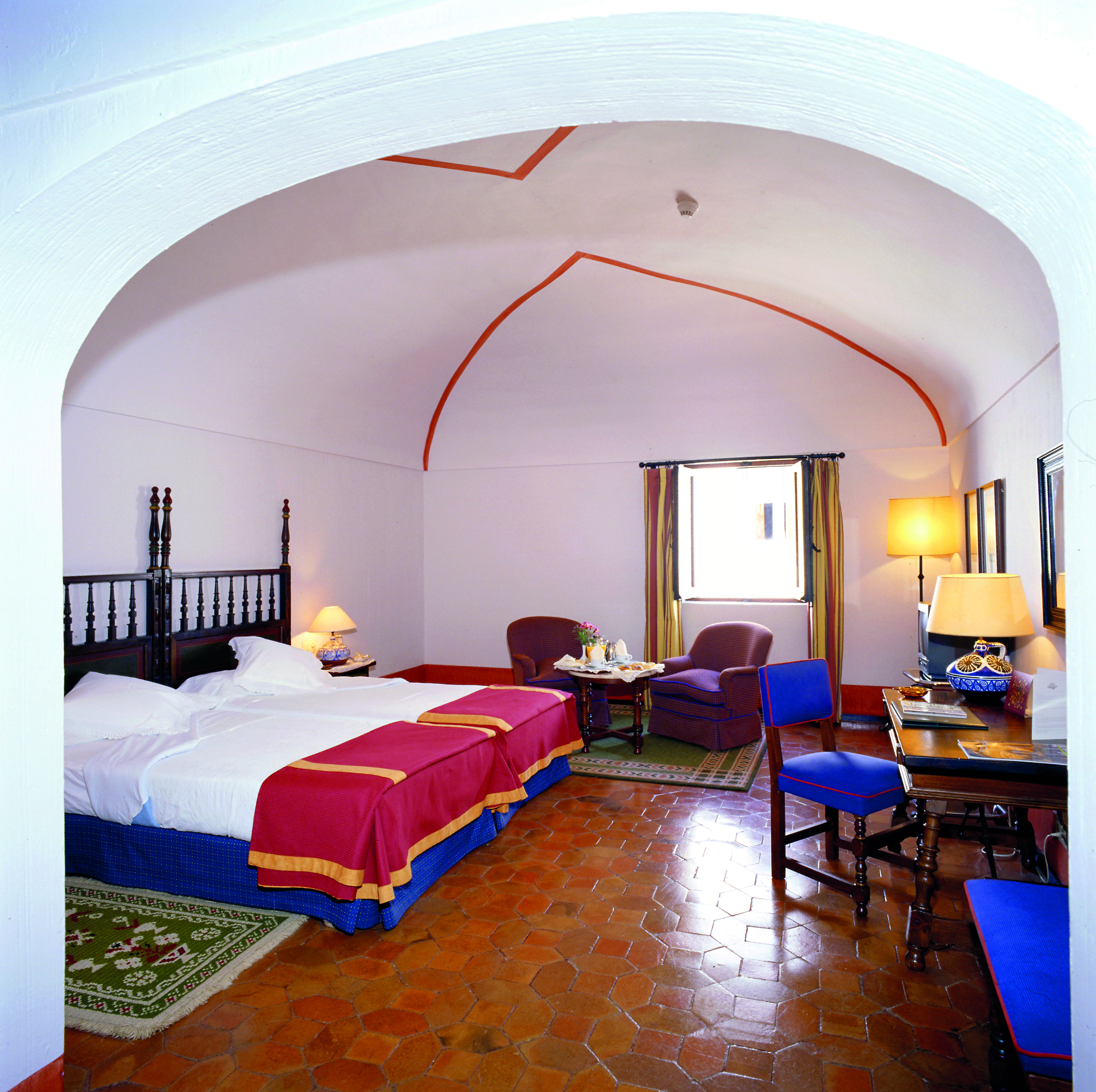 Parador de Merida Heart of Spain standard room bed armchairs traditional décor
