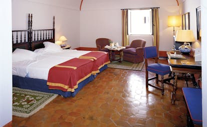 Parador de Merida Heart of Spain standard room bed armchairs traditional décor