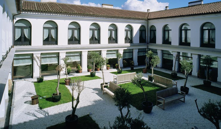 Parador de Trujillo Heart of Spain courtyard benches lawns trees