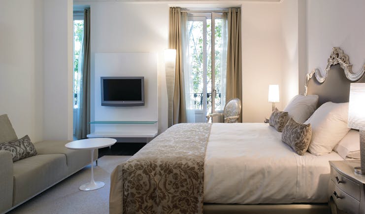 Hospes Madrid deluxe alcala guest room bed sofa balconies contemporary décor