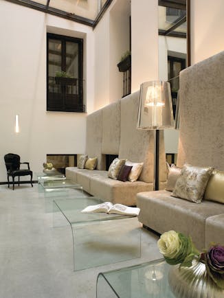 Hospes Madrid reception area sofas glass tables stylish décor
