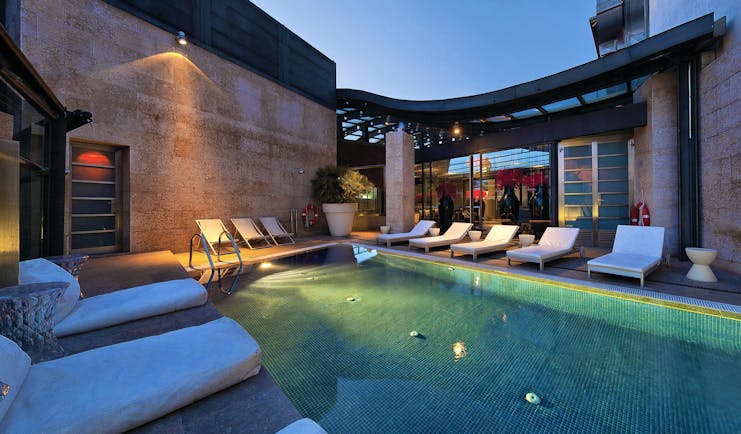 Hotel Urban Madrid pool outdoor sun loungers modern architecture