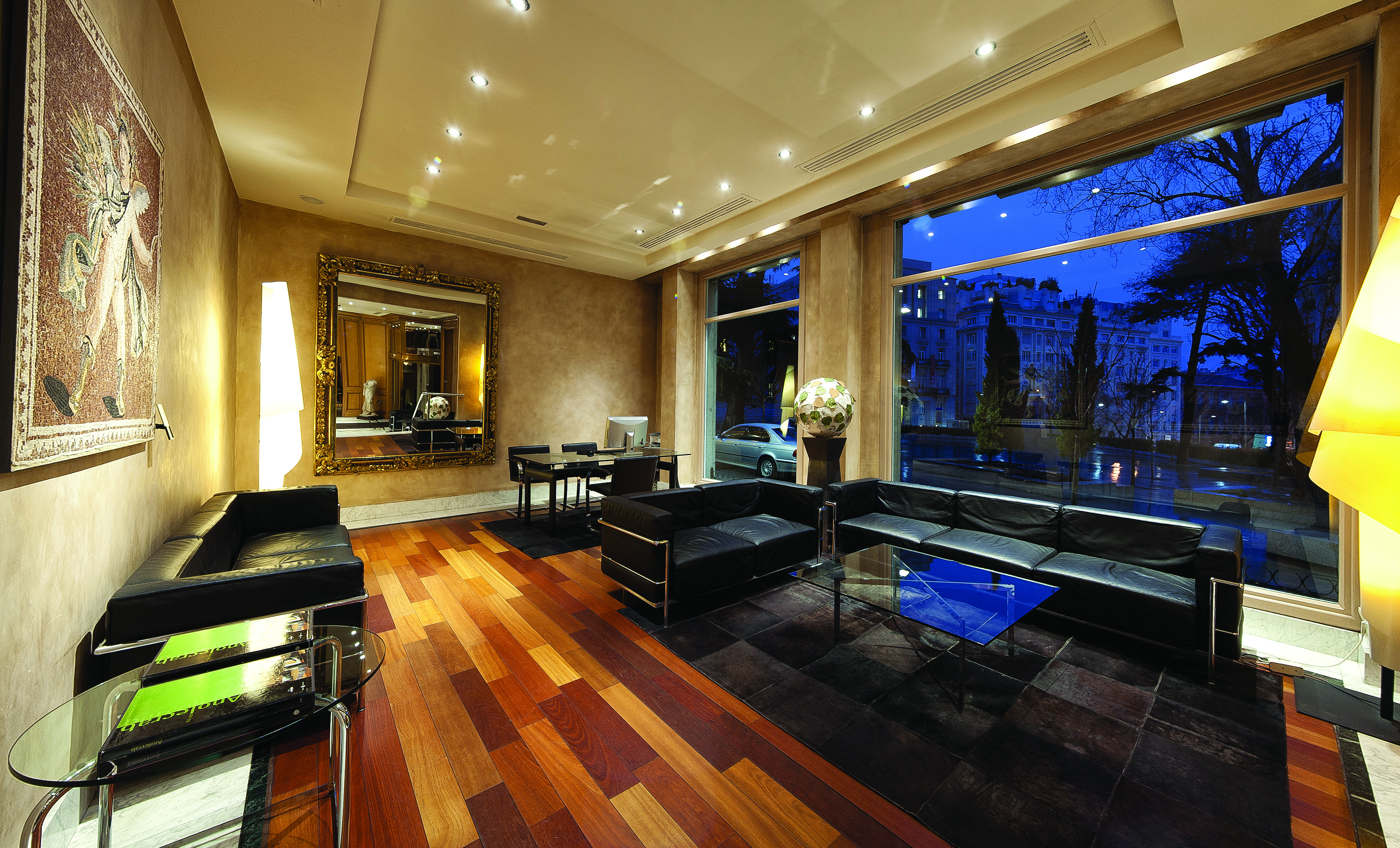 Villa Real Madrid lobby sofas large glass window elegant décor