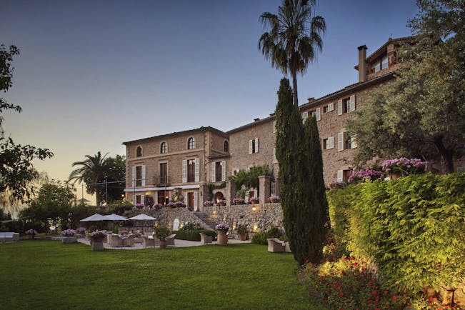 La Residencia Mallorca exterior stone building lawns outdoor dining terrace gardens 