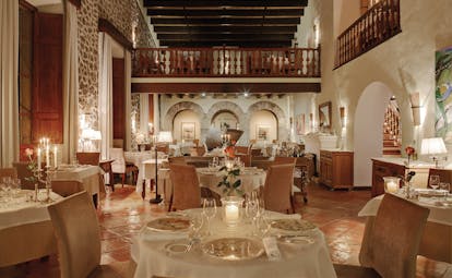 La Residencia Mallorca restaurant indoor dining rustic classic decor exposed stone walls