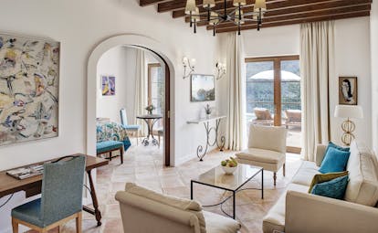 La Residencia Mallorca suite lounge area archway to bedroom modern classic decor private outdoor pool