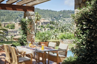 La Residencia Mallorca terrace dining breakfast private pool hillside view