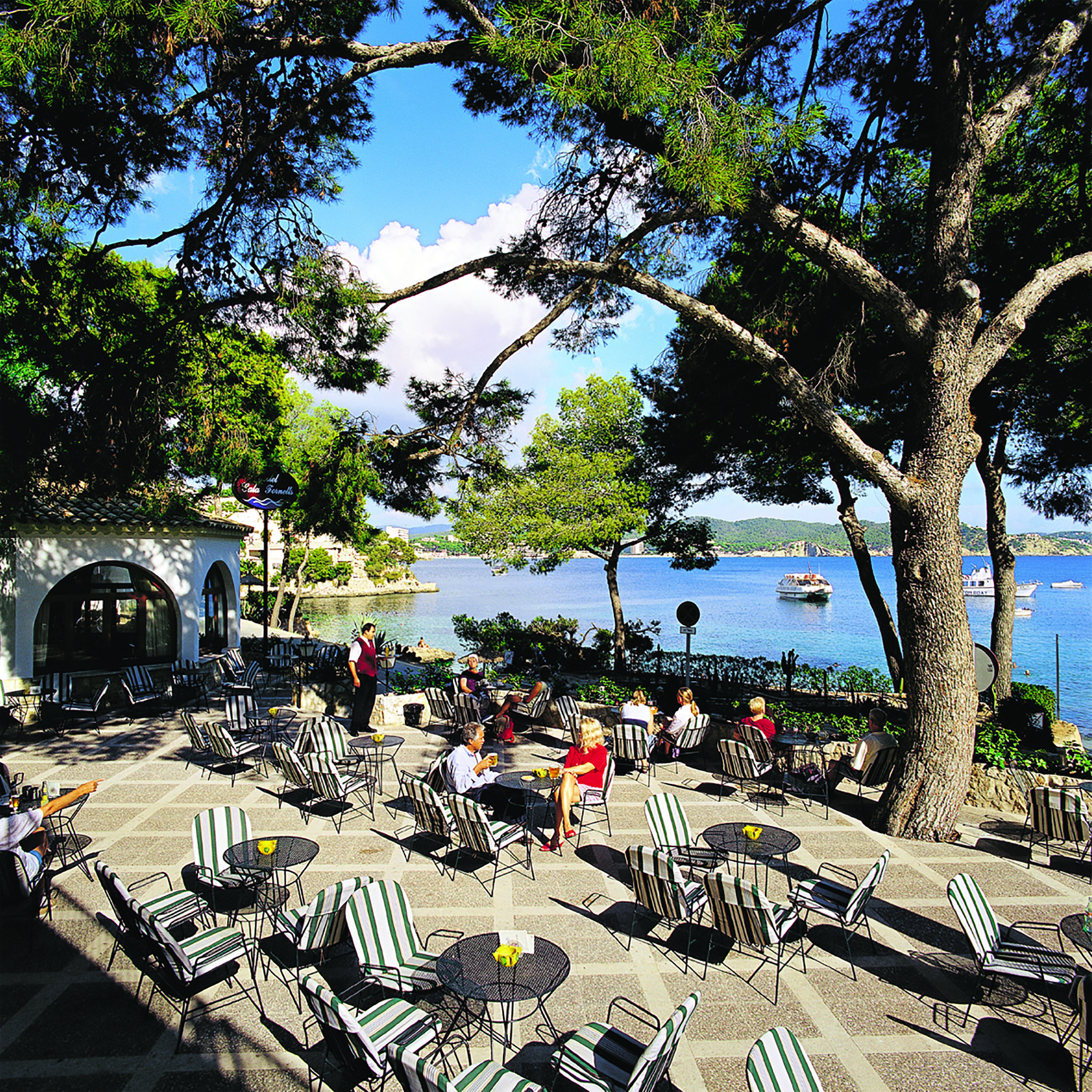 Cala Fornells Mallorca terrace outdoor seating dining area overlooking the sea