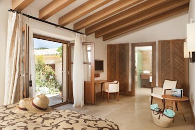 Castell Son Claret Mallorca garden suite bed en suite bathroom garden terrace modern décor