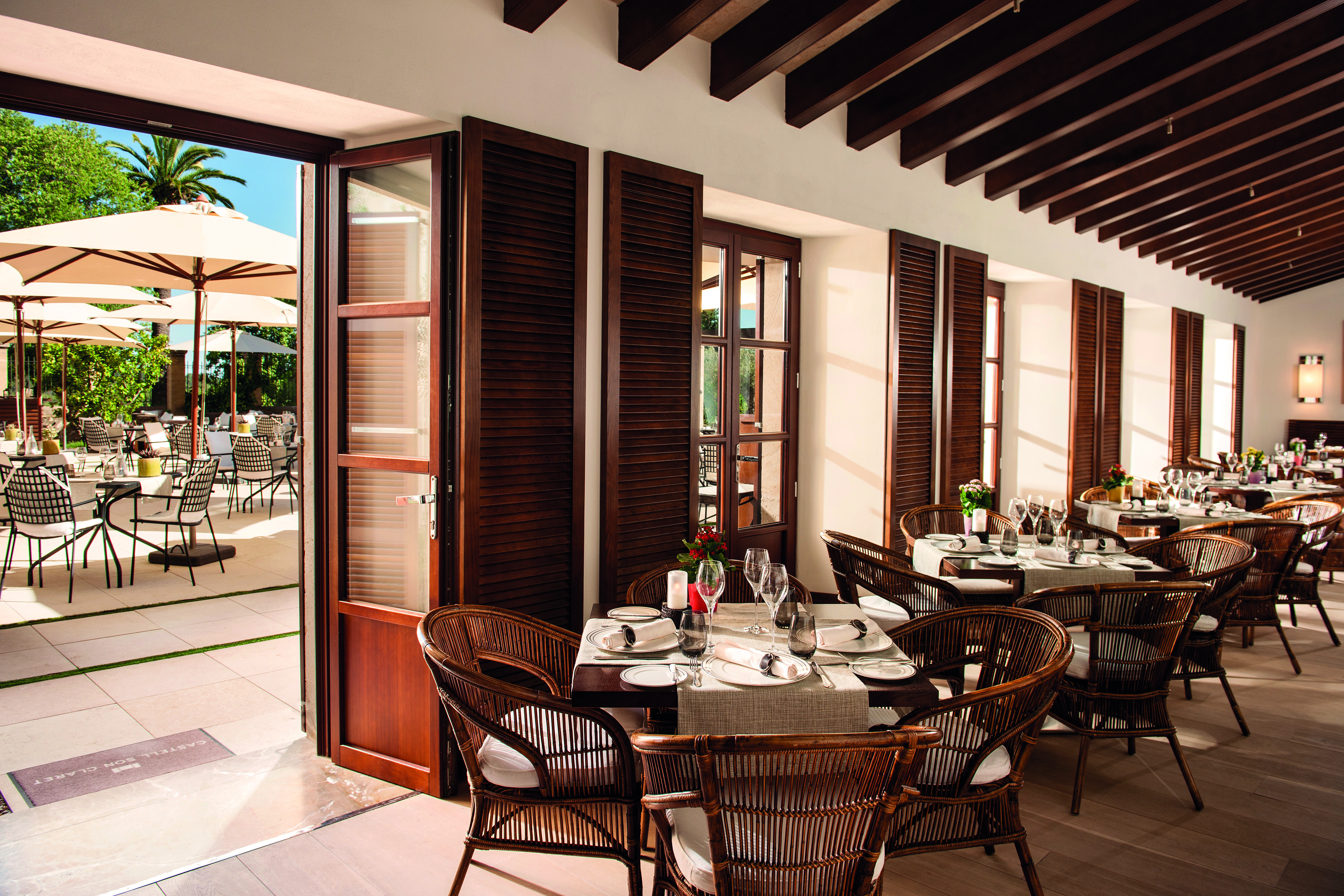 Castell Son Claret Mallorca winter garden communal indoor seating area modern décor