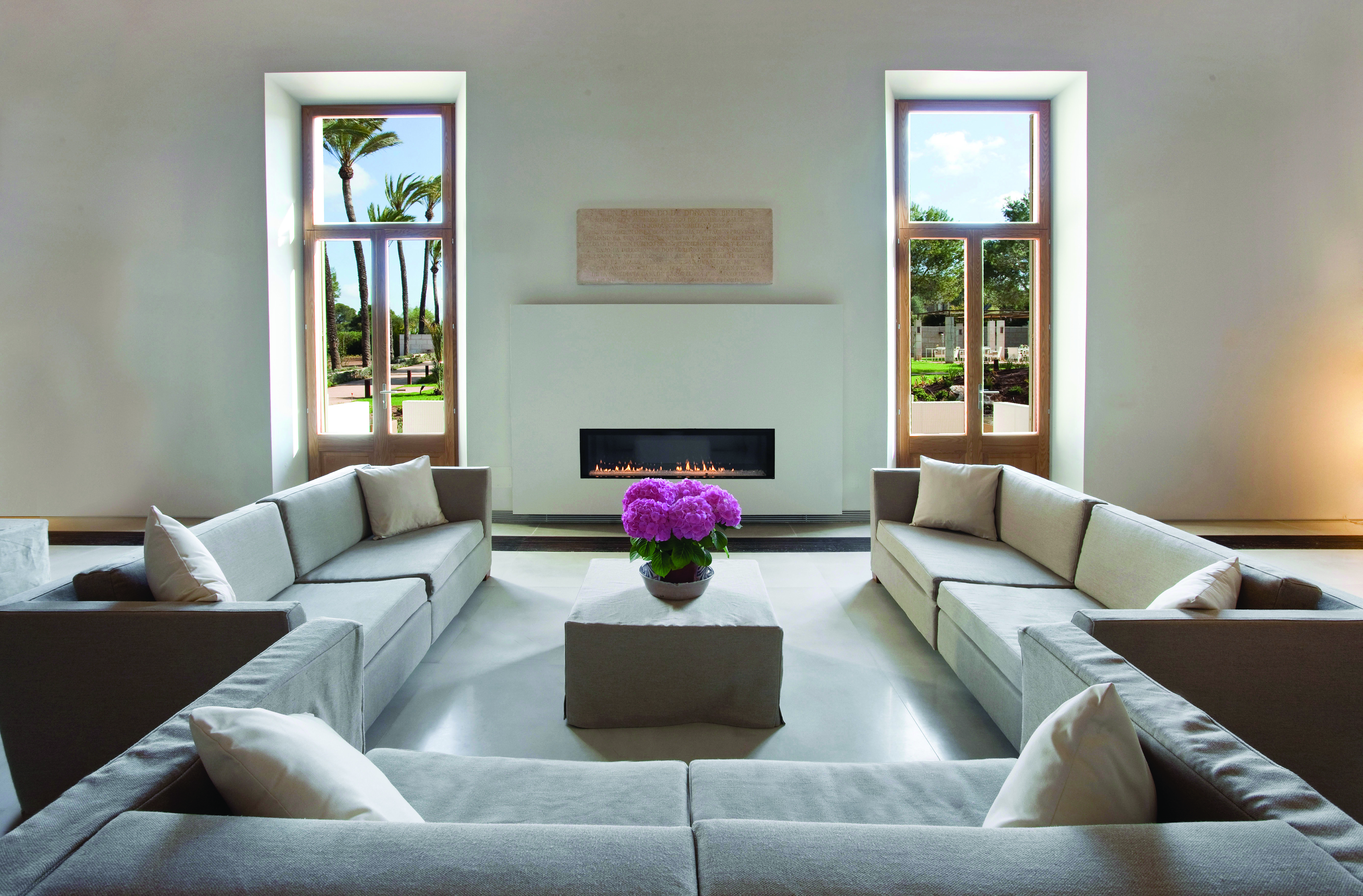 Font Santa Mallorca salon indoor communal seating area sofas modern fireplace garden views