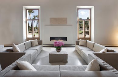 Font Santa Mallorca salon indoor communal seating area sofas modern fireplace garden views
