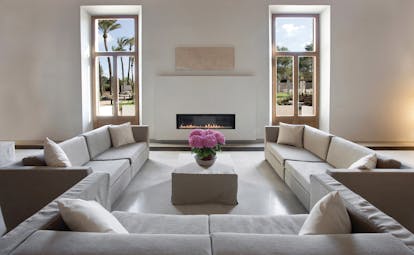 Font Santa Mallorca salon indoor communal seating area sofas modern fireplace garden views