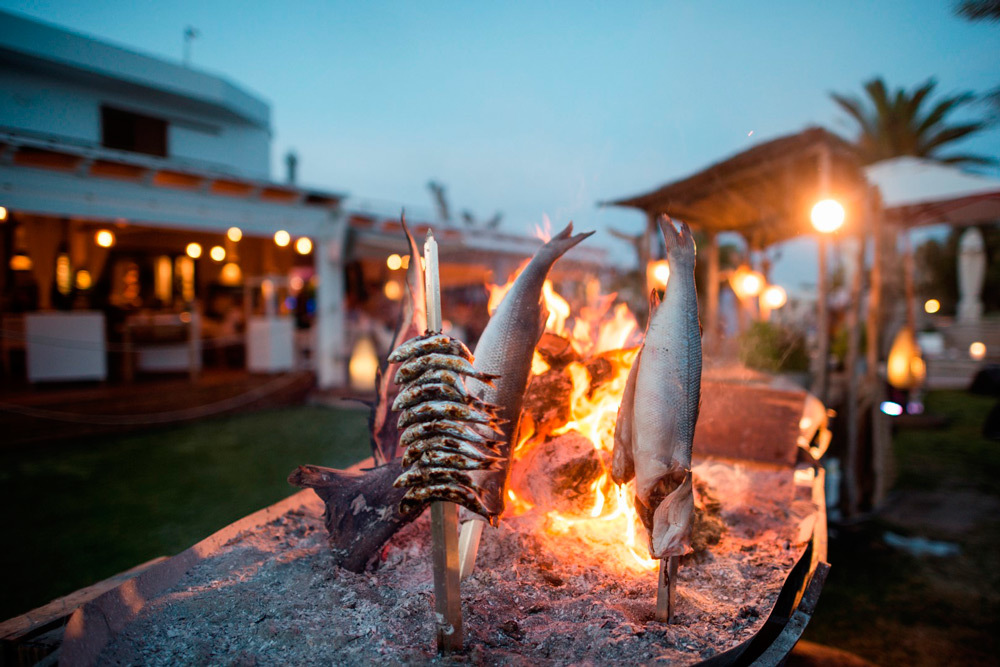 Gecko Beach House seafood barbecue on a boat in the evening