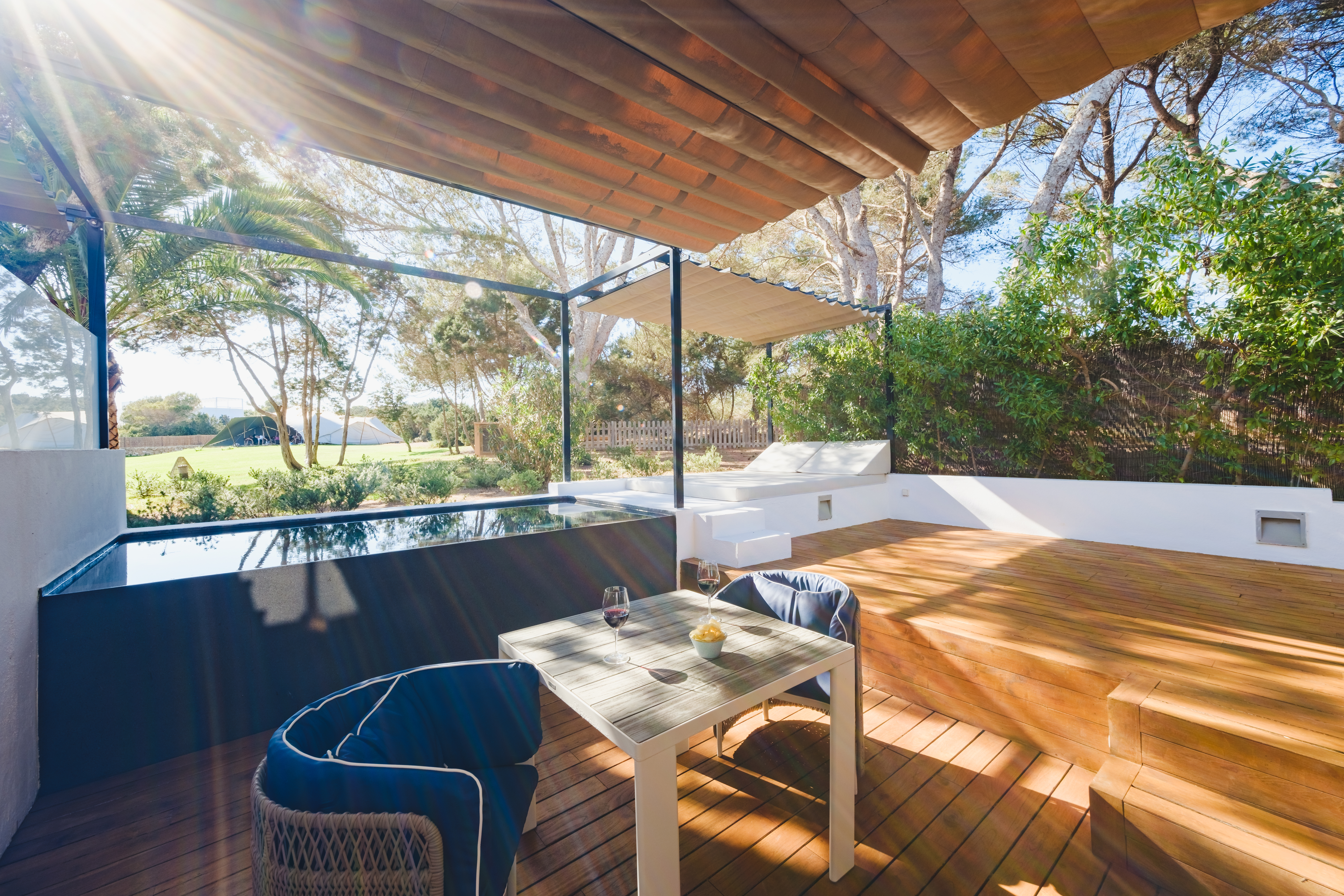 Gecko Beach House Pool Corner Suite with two-level decking, daybed, and plunge pool, surrounded by trees