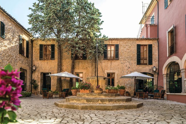 Gran Hotel Son Net Mallorca courtyard trees potted plants 