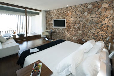 Hospes Maricel Mallorca natura deluxe bedroom native stone walls modern décor