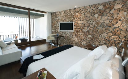 Hospes Maricel Mallorca natura deluxe bedroom native stone walls modern décor