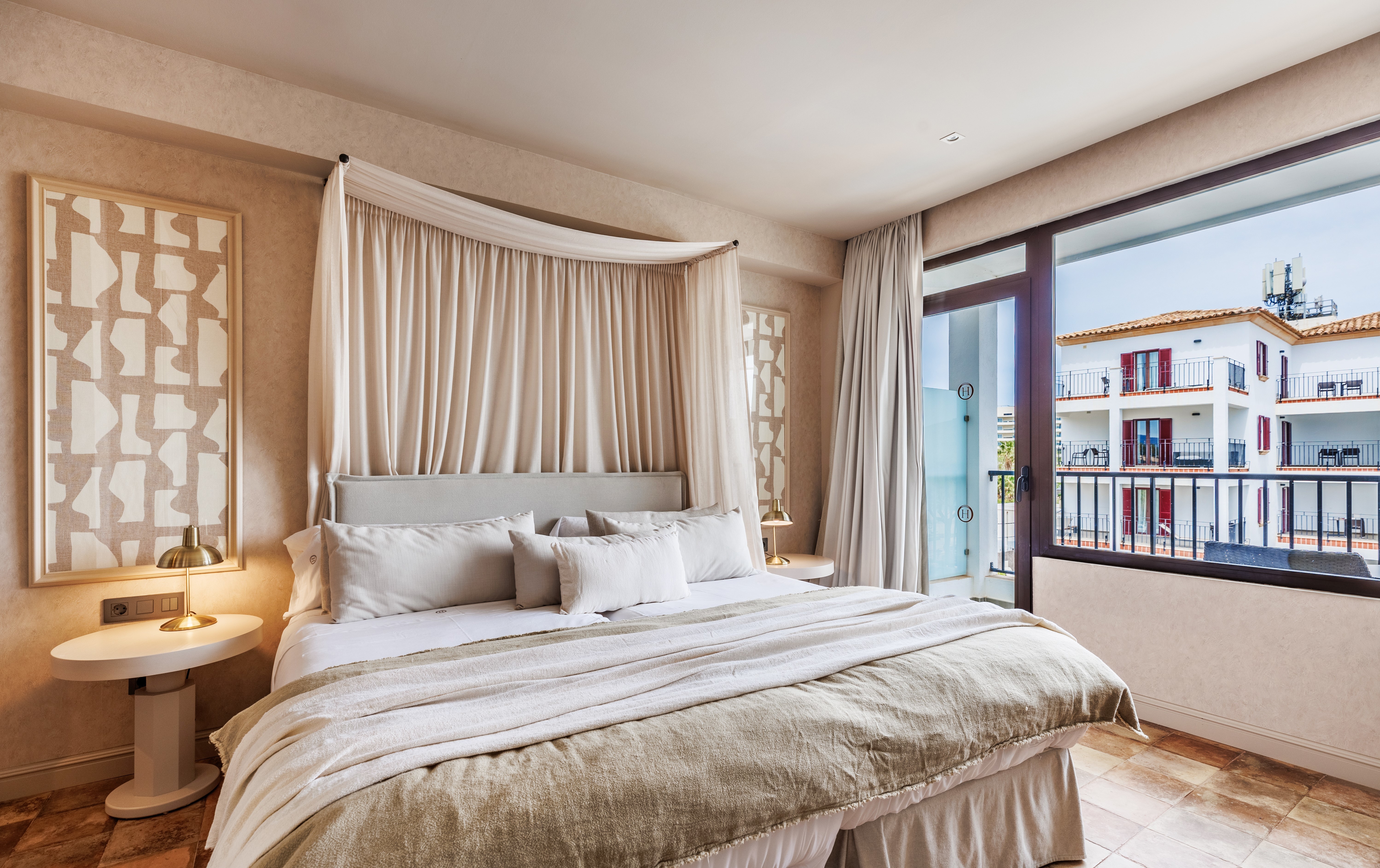 Hotel Hoposa Uyal Side Sea View Room with elegant bed with draped headboard, neutral colour palette, and views across the hotel grounds