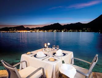 Hotel Illa d'Or Mallorca romantic dining table set for two night time overlooking the sea