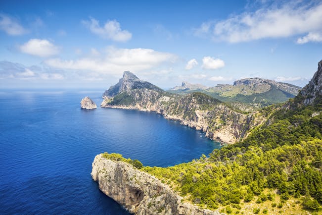 Rocky cliffs and headland overlooking blue sea at Cap Formentor in Mallorca