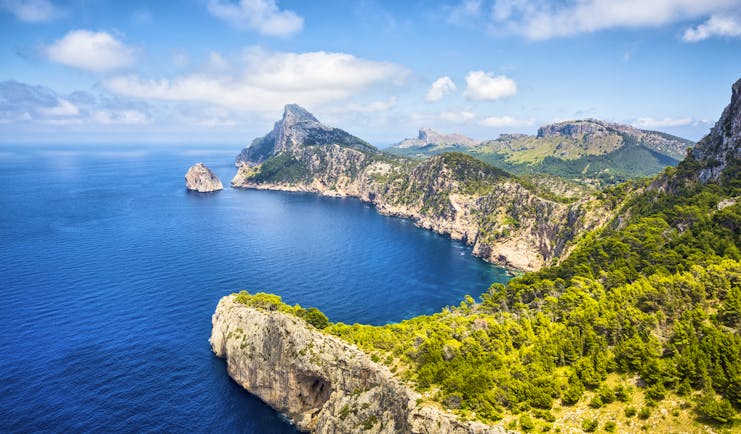 Rocky cliffs and headland overlooking blue sea at Cap Formentor in Mallorca