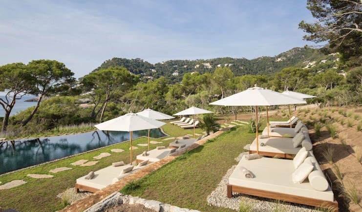 Pleta de Mar Mallorca infinity poolside sun loungers umbrellas overlooking sea