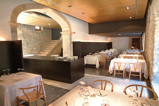 Son Brull Mallorca restaurant indoor dining area stone walls modern décor