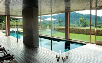 Son Brull Mallorca spa pool indoor pool large windows countryside views