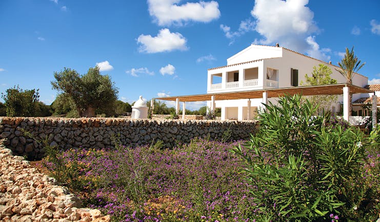 Torralbenc Menorca exterior hotel building flowers trees