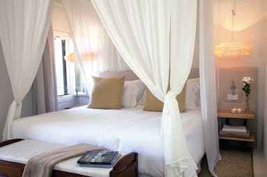 Torralbenc Menorca sea view room canopied bed modern décor