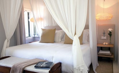 Torralbenc Menorca sea view room canopied bed modern décor