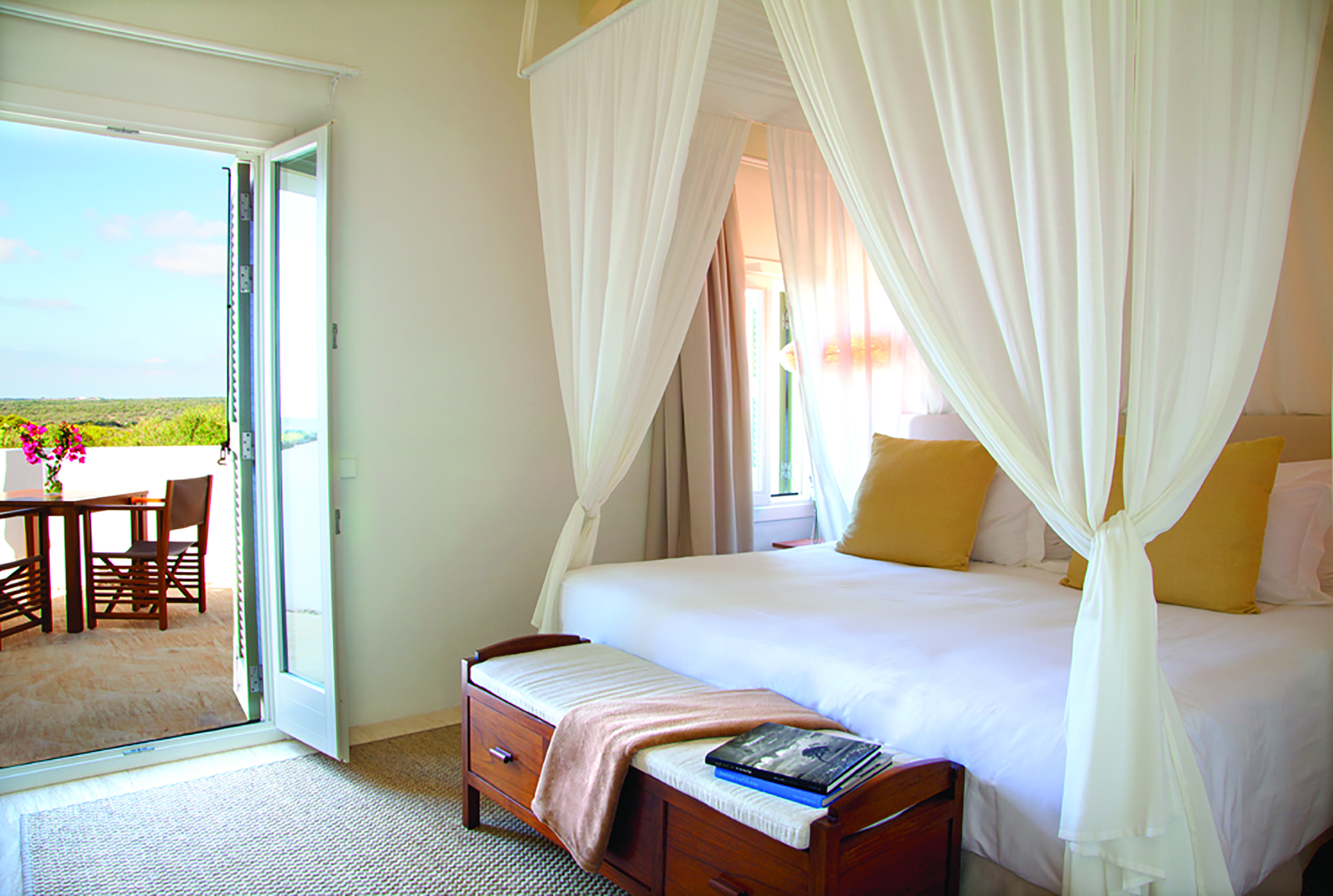 Torralbenc Menorca sea view room terrace canopied bed modern décor